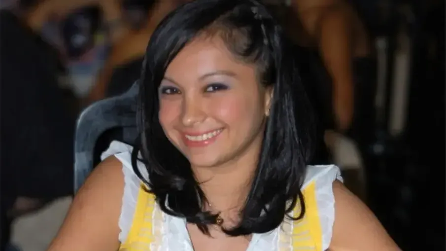 a foreign man in a white shirt with his arm around a beautiful woman