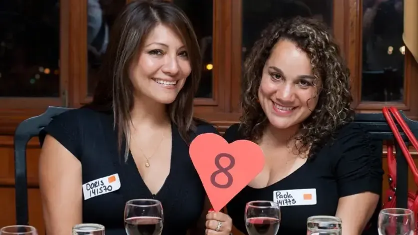 Latinas posing for a photo.