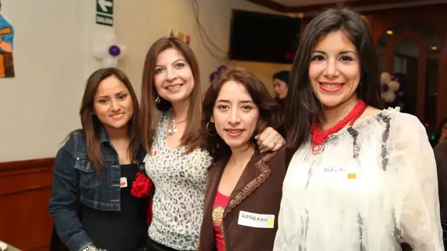 Mexican women posing for a photo.