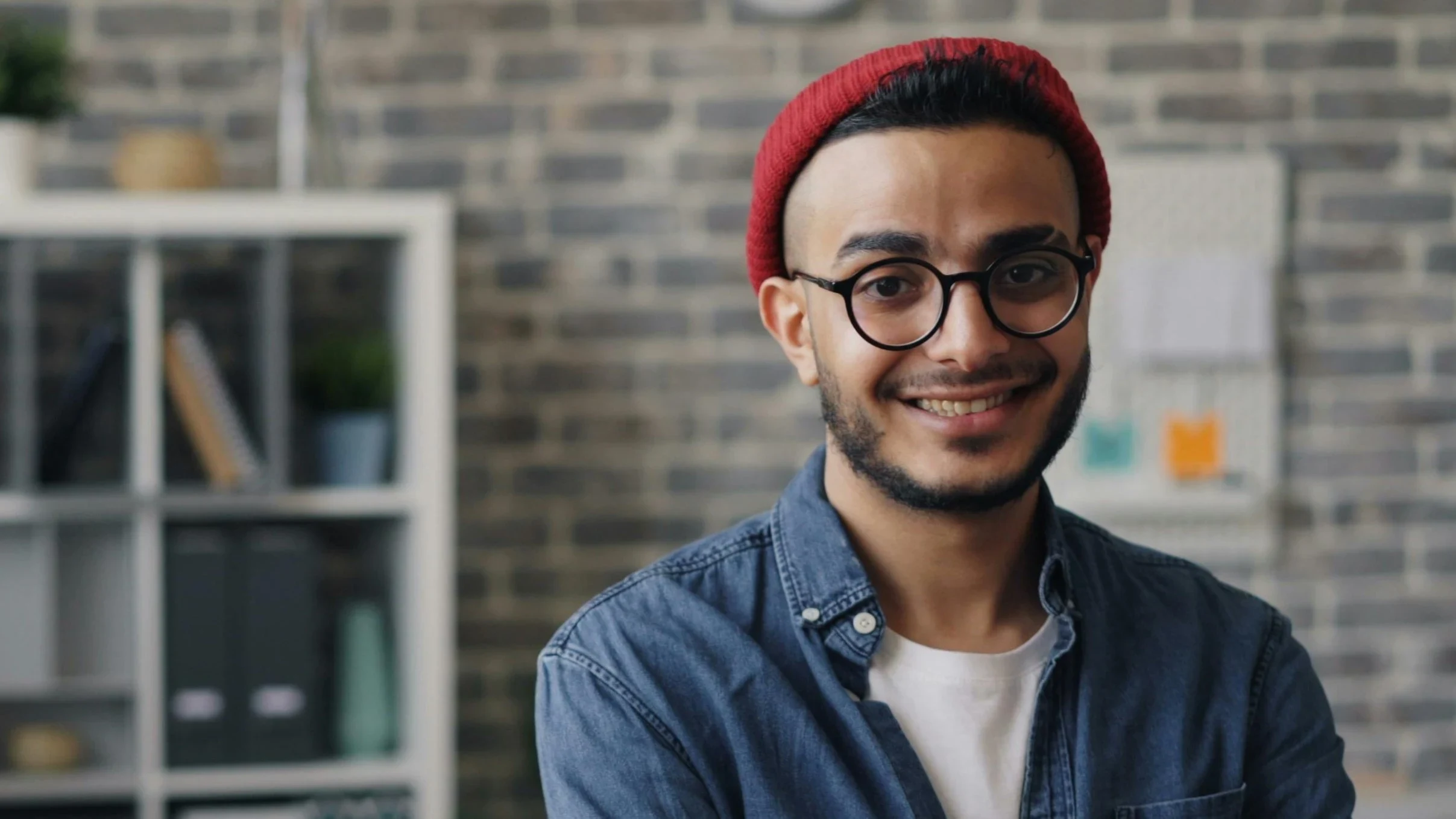 A guy wearing a red beanie