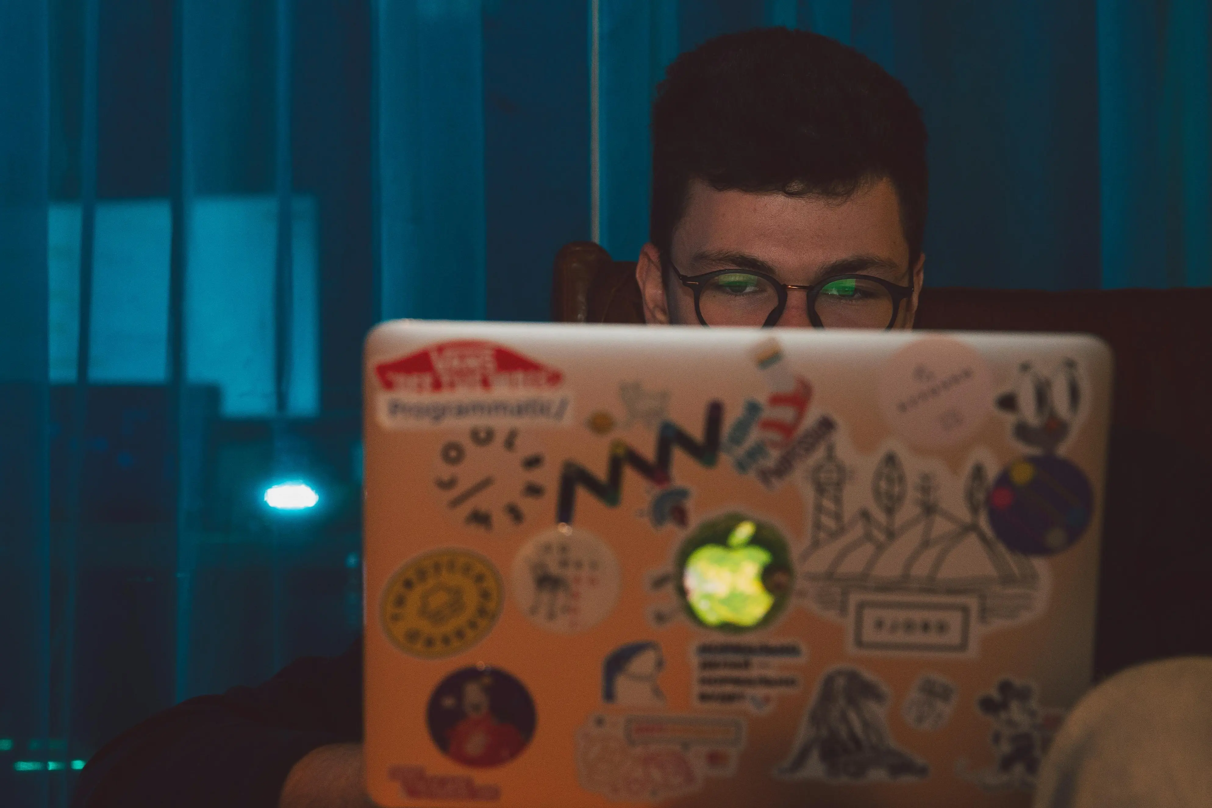 A man surfing the internet on a laptop