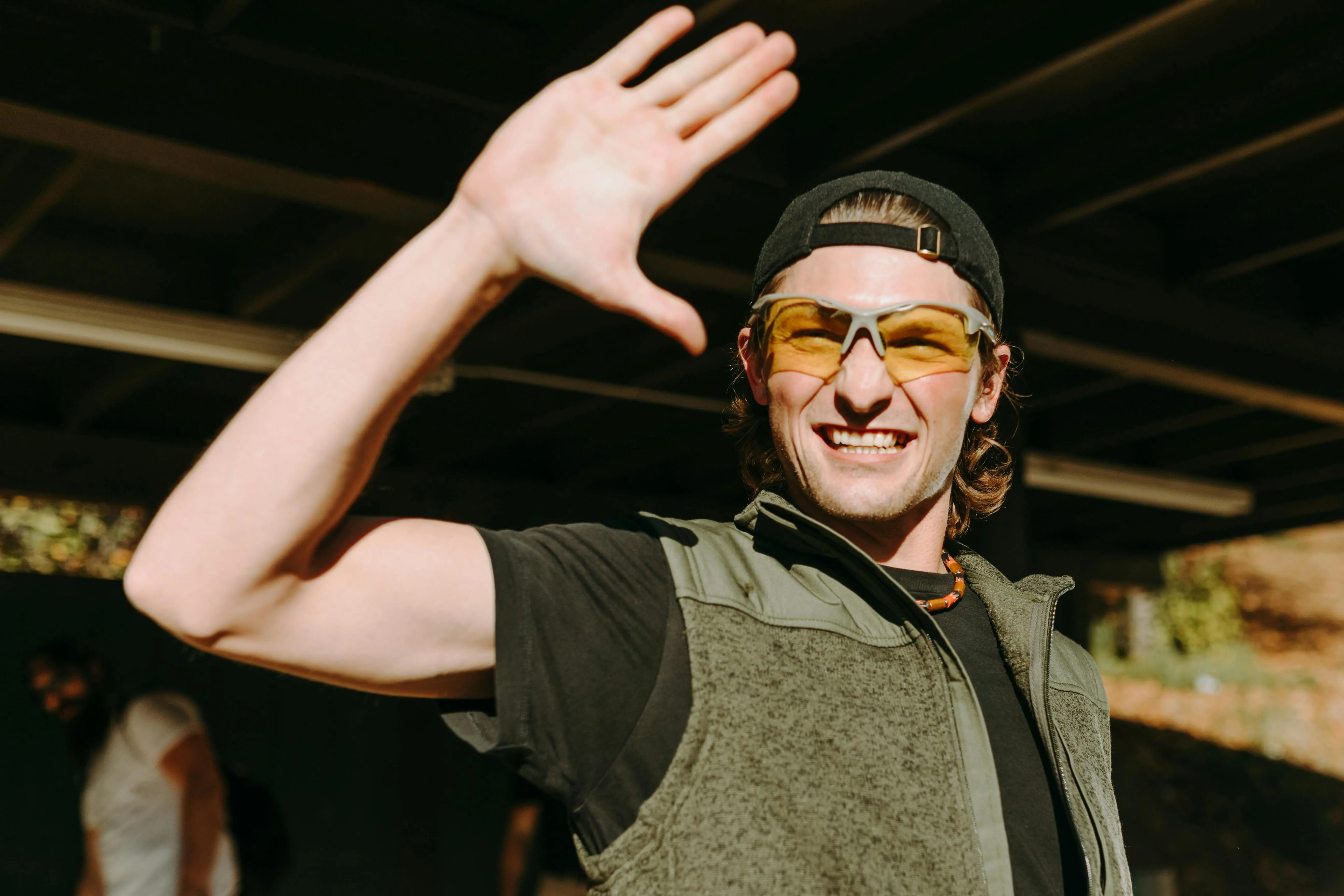 A man covering his face from the sun