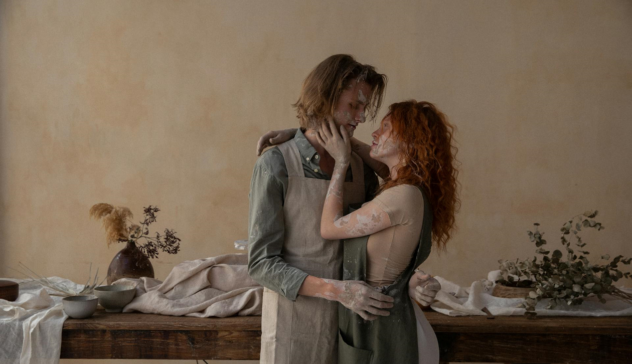 A man and a woman employing the triangle method