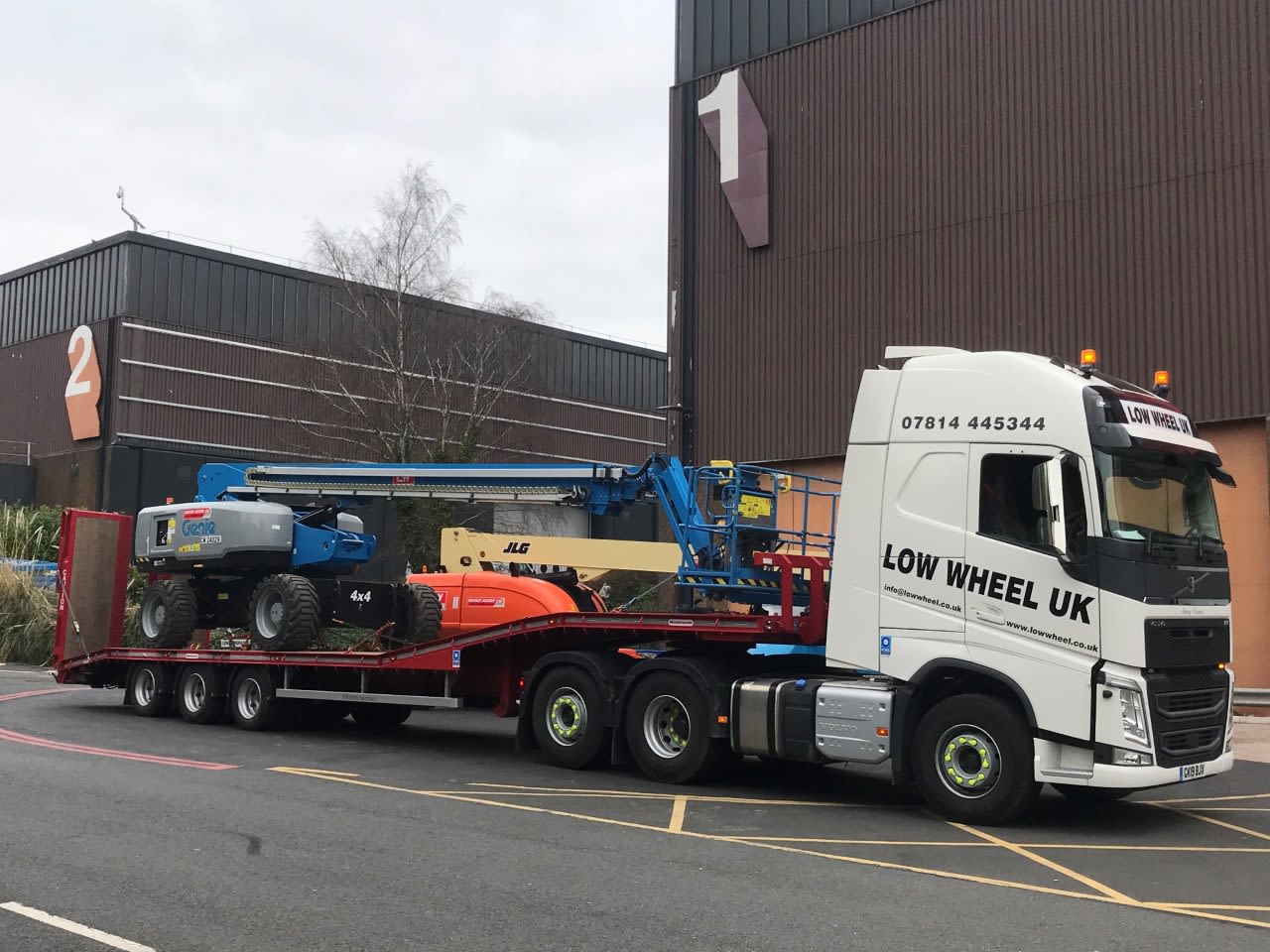 Powered access equipment transport