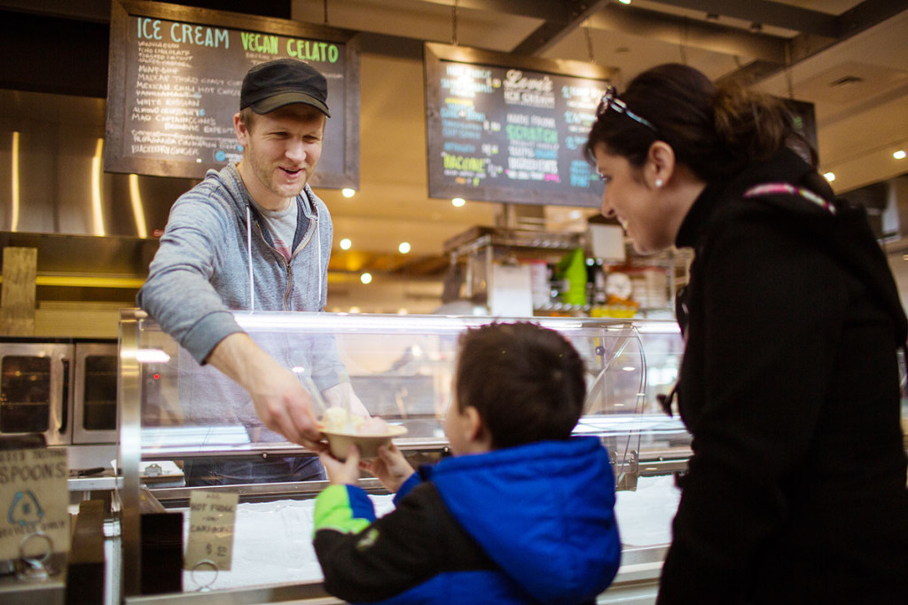 boy buying ice cream at an ice cream shop