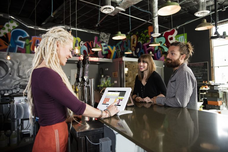 merchant taking customer order on ShopKeep POS