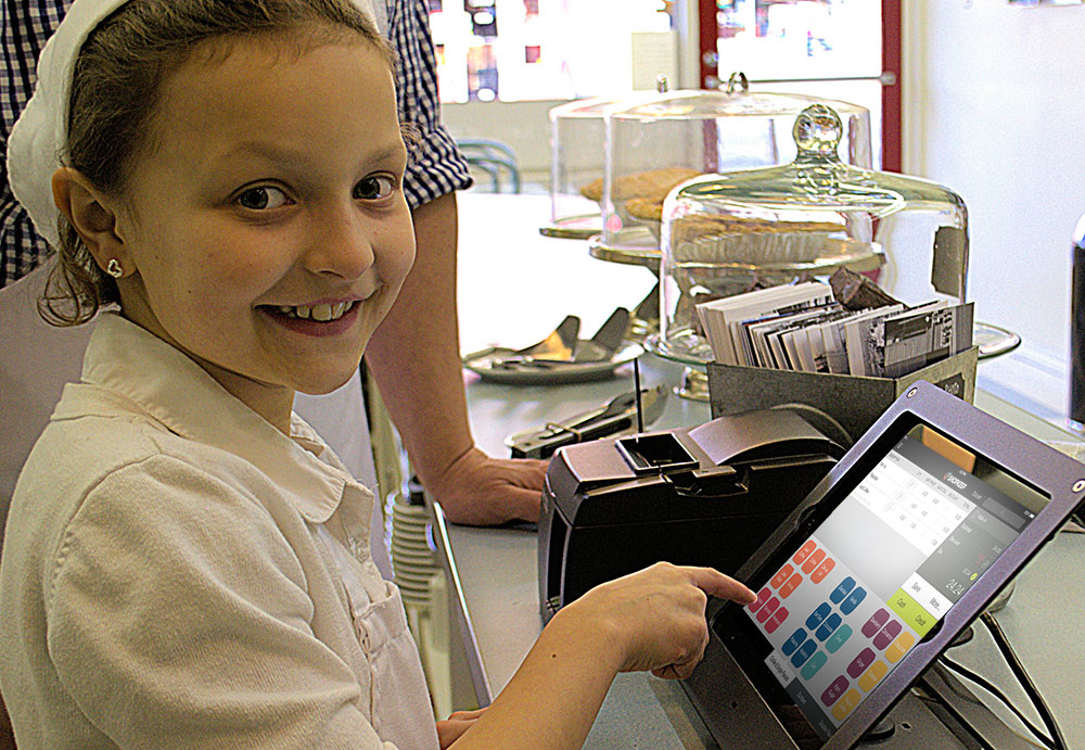 child with shopkeep terminal