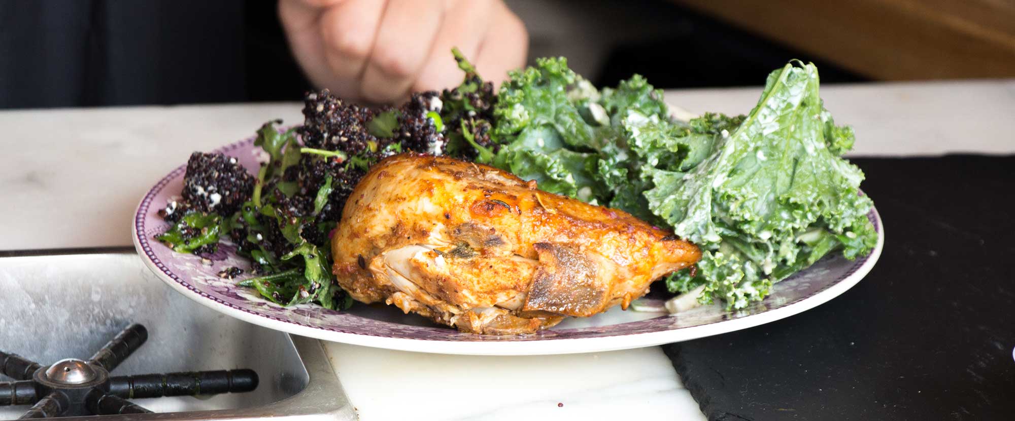 restaurant owner serving chicken