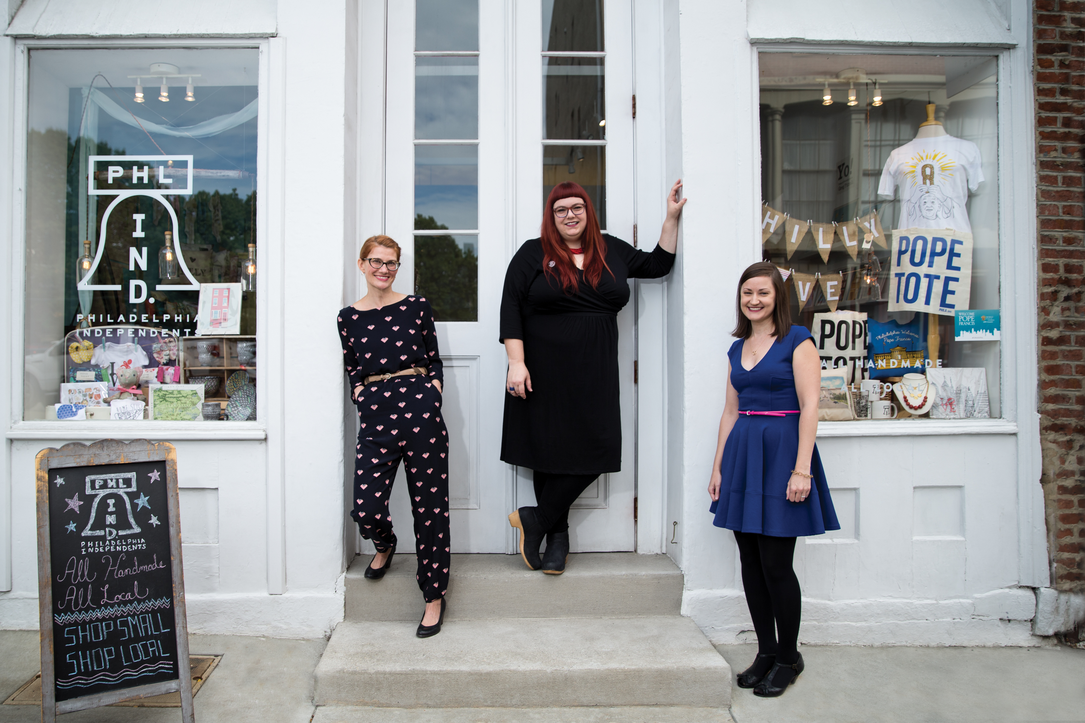 small business owners outside storefront