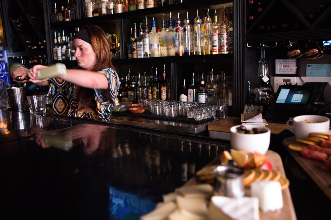 woman shaking a drink