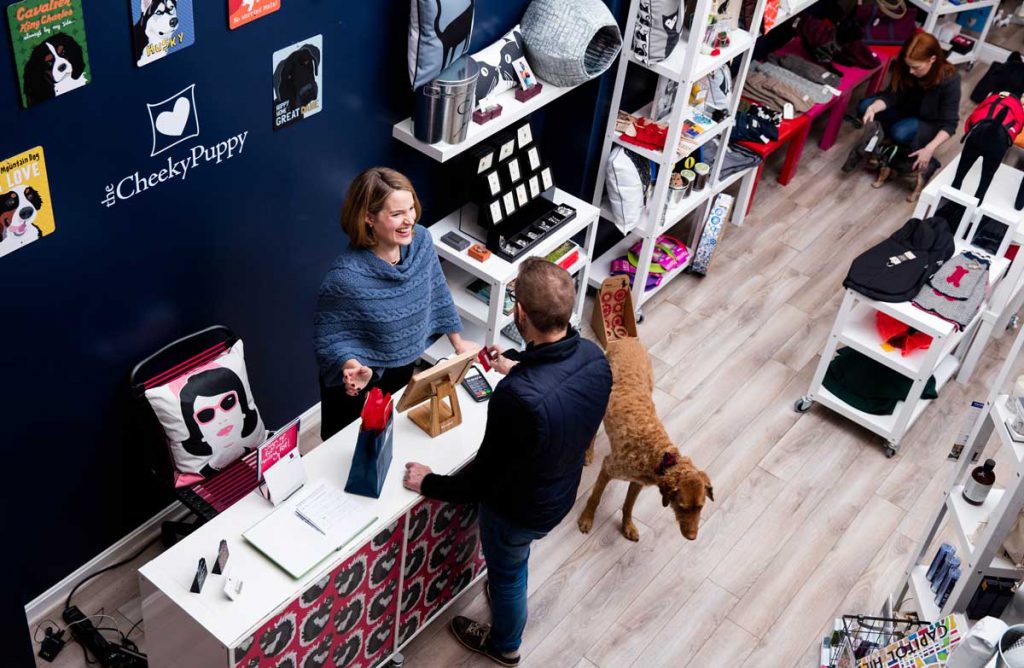 Aerial view of a customer and employee at a pet store.