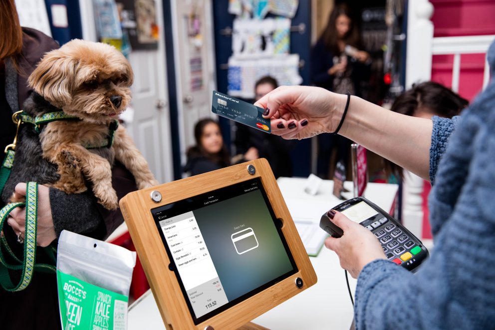 Employee running a retail transaction on a POS system.