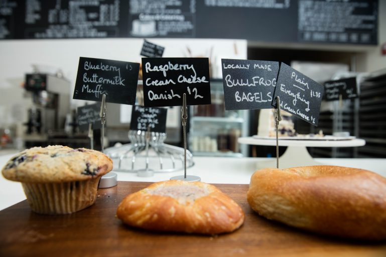 Pastries displayed on a counter in a coffee shop.