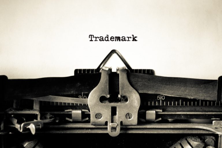 A typewriting typing out trademark.