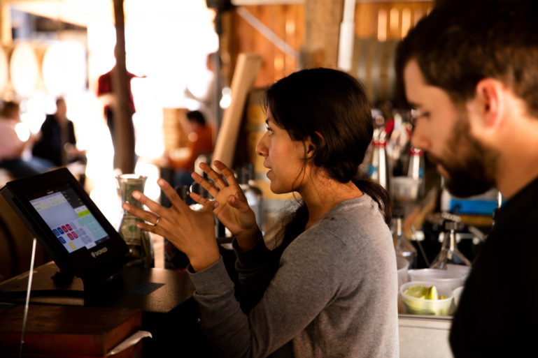 shop owner using a cloud-based POS system