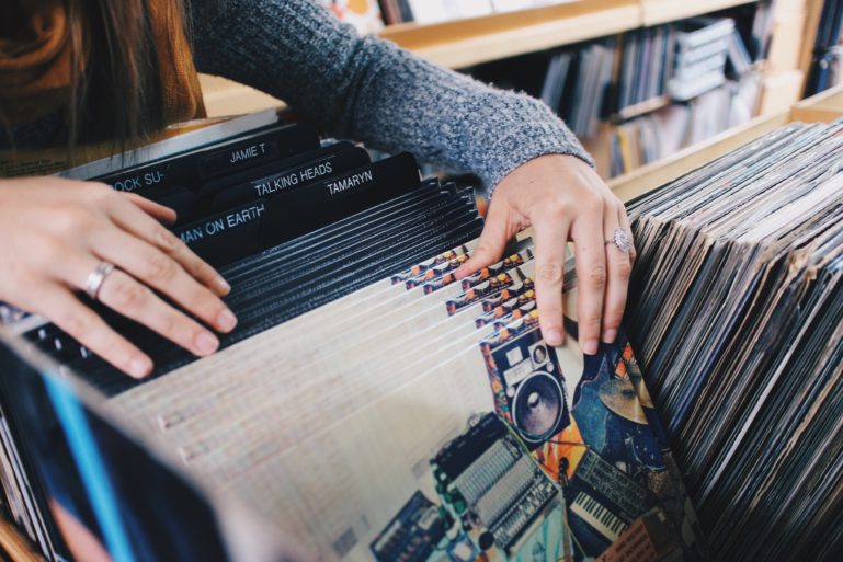 retail store owner sorting through records - time management tips for retailers