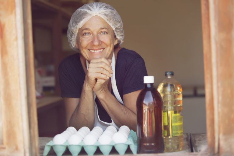 woman with hairnet behind a tray of eggs - what is a business plan