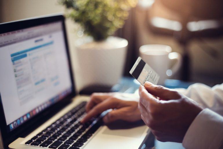 man making a purchase online- advantages and disadvantages of ecommerce