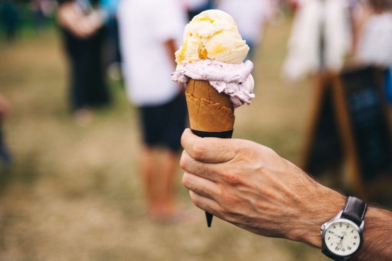 hand holding ice cream cone - starting an ice cream truck business