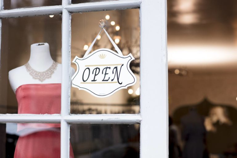 small business open sign - customer retention tactics