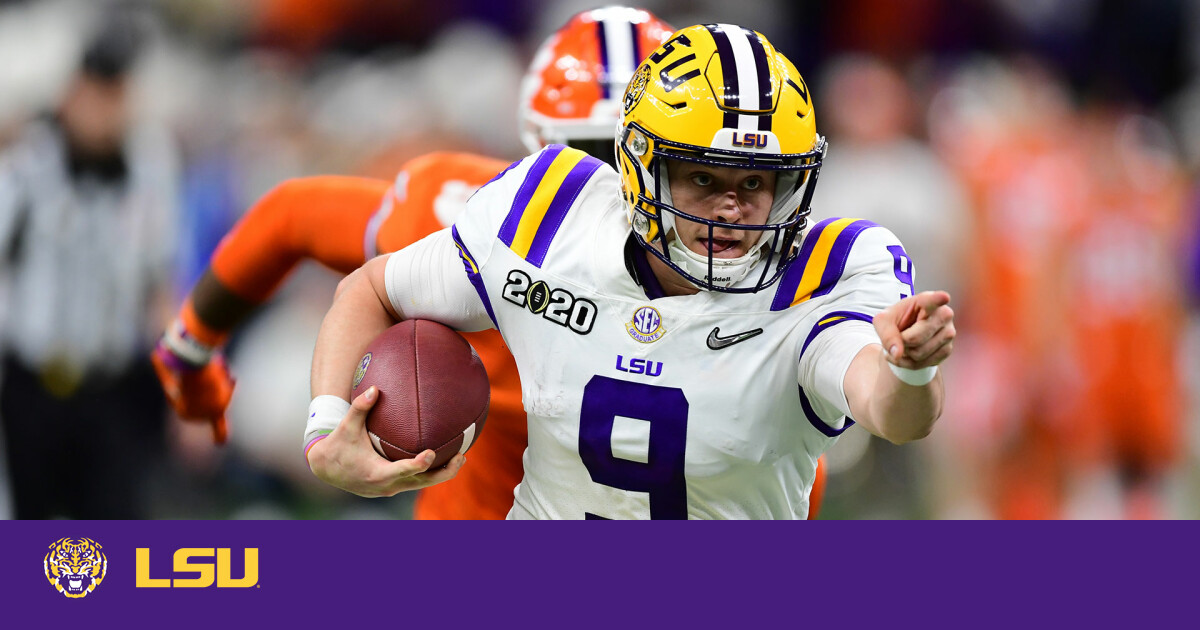 Joe Burrow LSU Tigers Unsigned White Jersey Warming Up At Night Under The  Spotlights Photograph