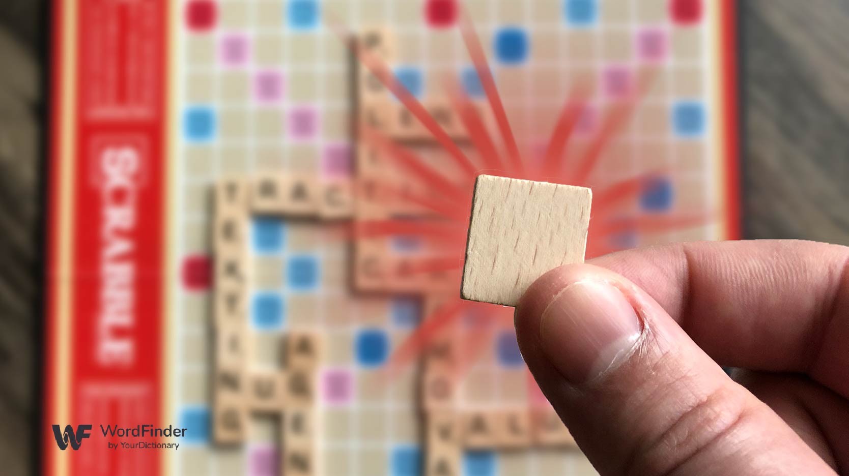 blank scrabble tile with starburst