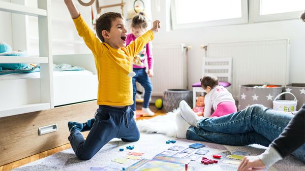 boy playing board game learn vocabulary