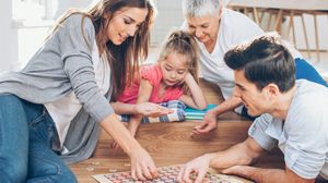 Family playing a board game together