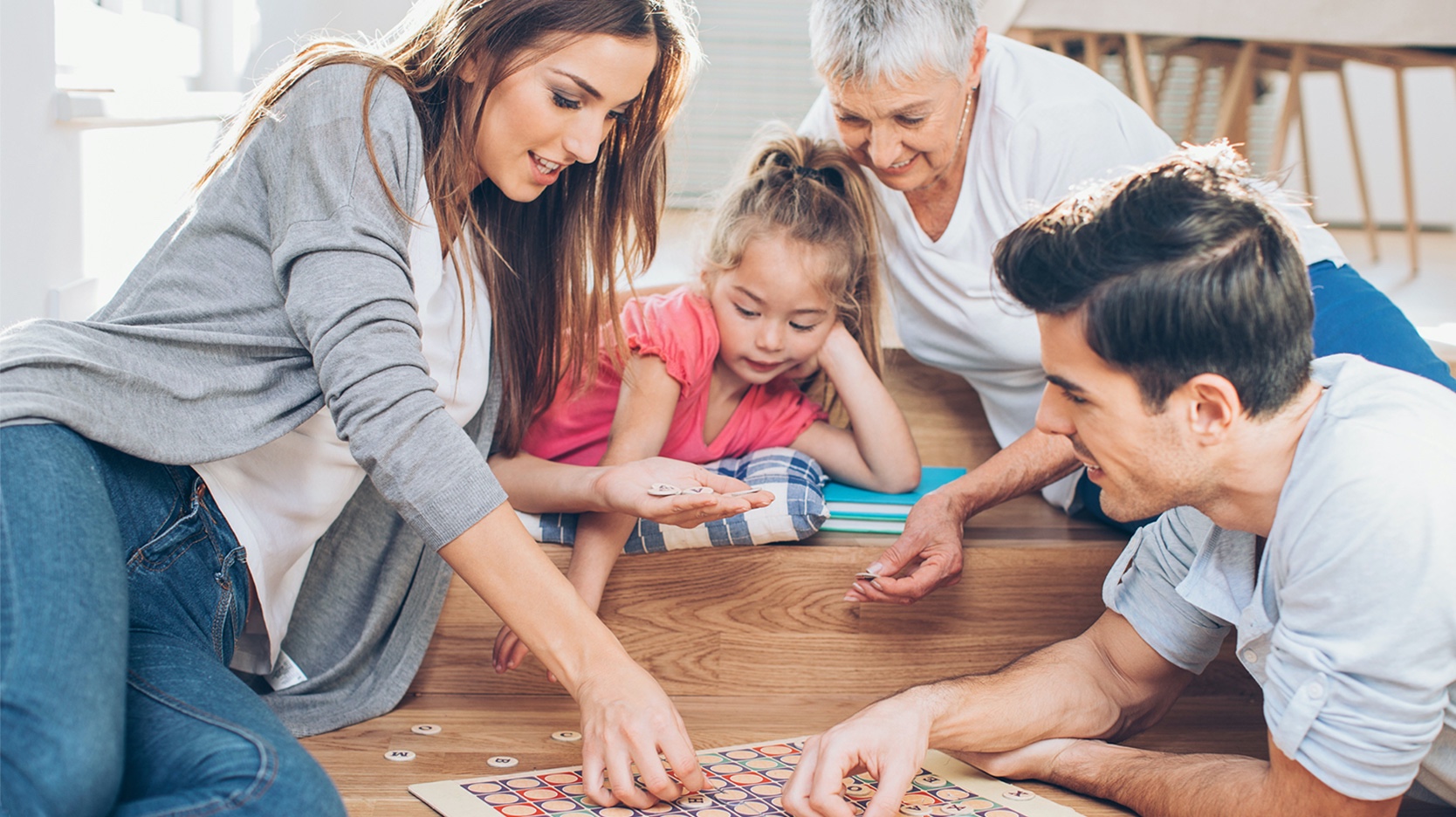 Family playing a board game together