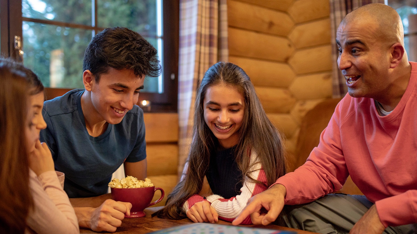 Family playing Words With Friends Board Game