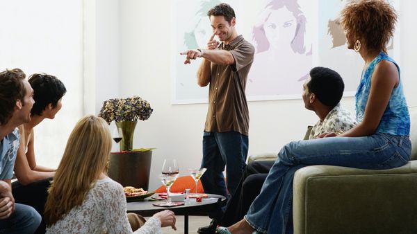 Group of friends playing Charades