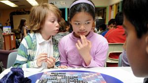 children playing in school scrabble tournament