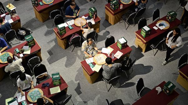 people playing in scrabble tournament