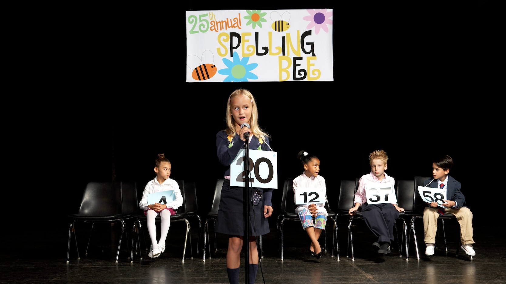 Spelling bee competition with black background