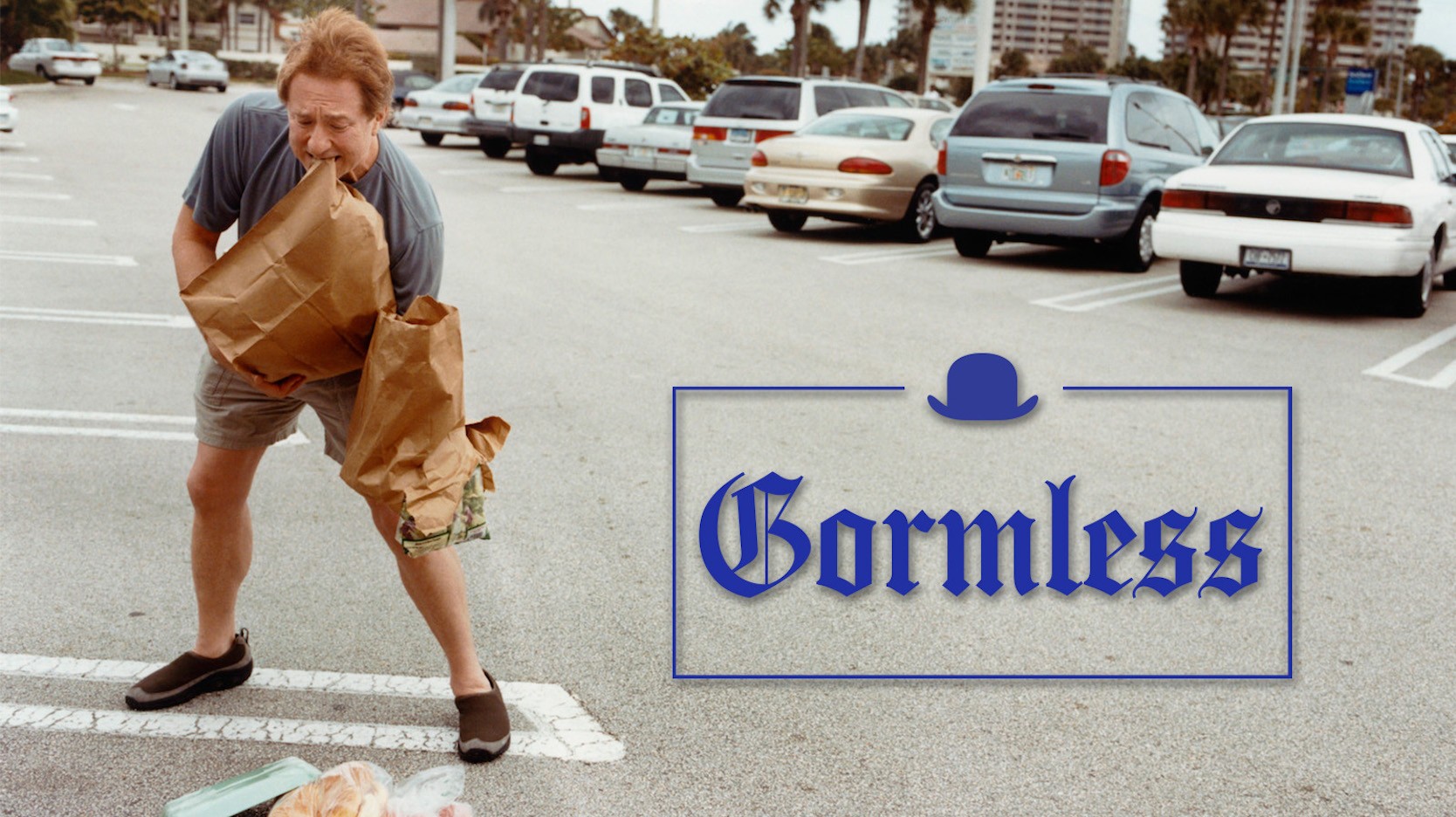 Man clumsily dropping grocery bags