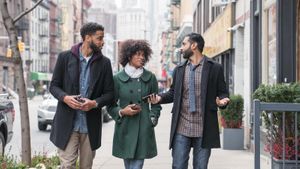 friends talking on street in New York City