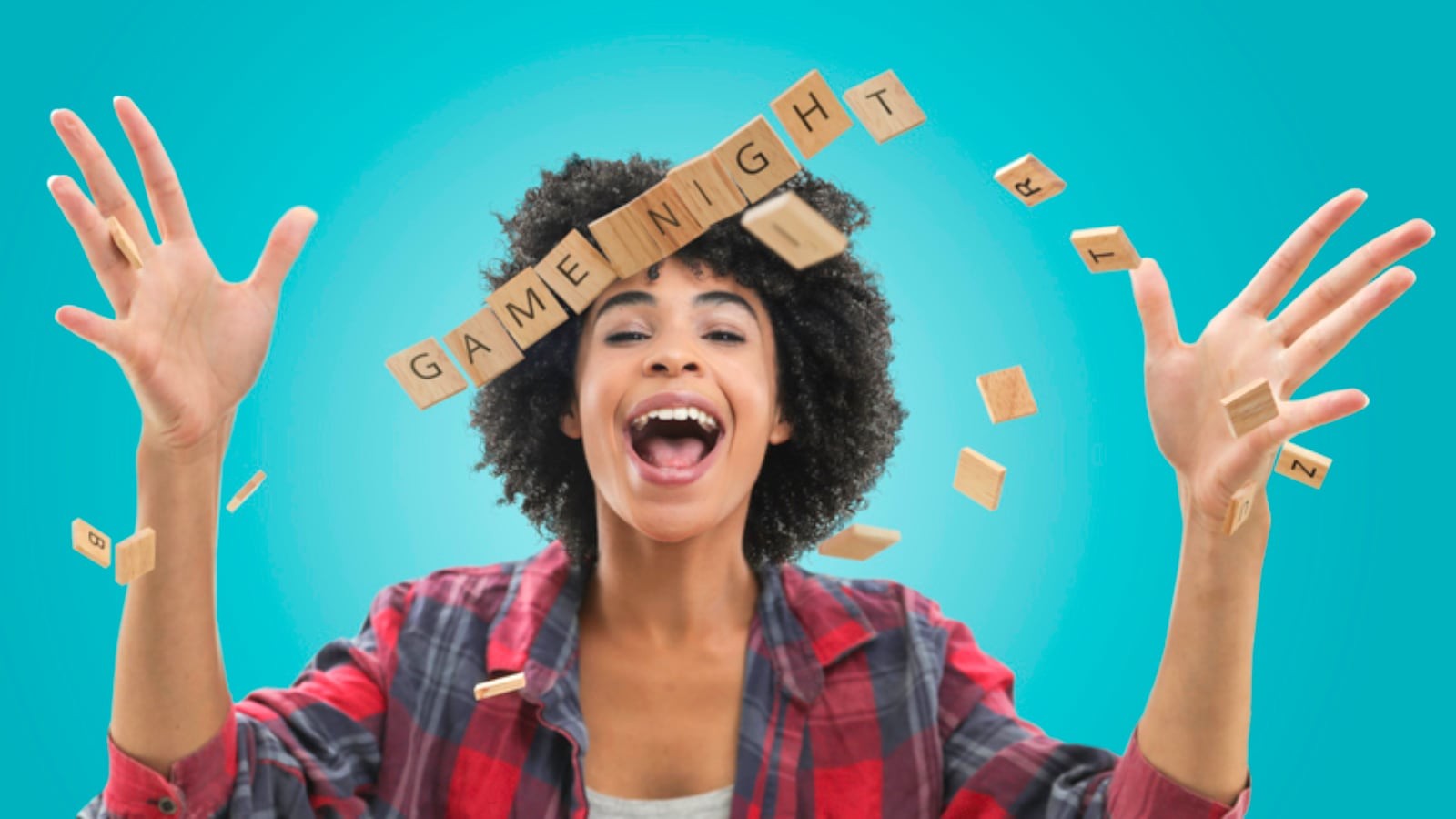 Happy woman throwing up Scrabble tiles