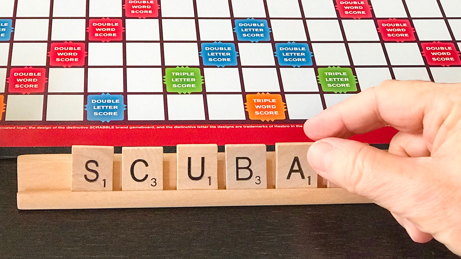 Scrabble letters spelling the acronym SCUBA