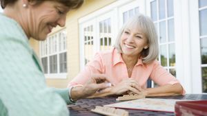 Two women playing Scrabble