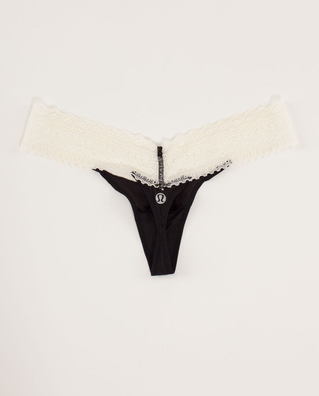 https://storage.googleapis.com/lulu-fanatics/product/12396/1280/lululemon-foxy-lulu-thong-black-polar-cream-8455-68608.jpg