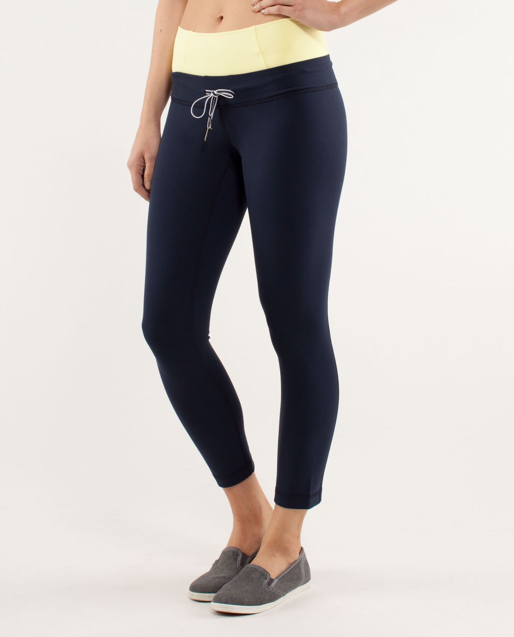 https://storage.googleapis.com/lulu-fanatics/product/13105/1280/lululemon-invert-crop-inkwell-mellow-lemon-10494-73641.jpg