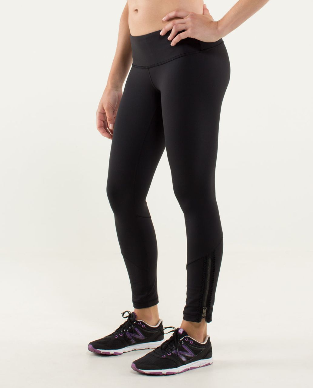 Navy Lululemon leggings with side ruffle details and pockets