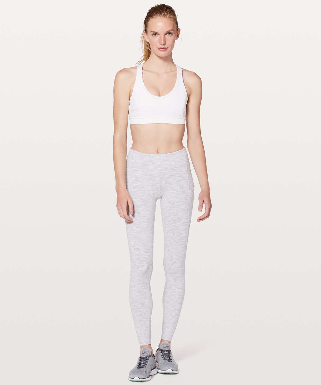 Lulu lemon yoga pants and white sports bra on a jog - Spandex