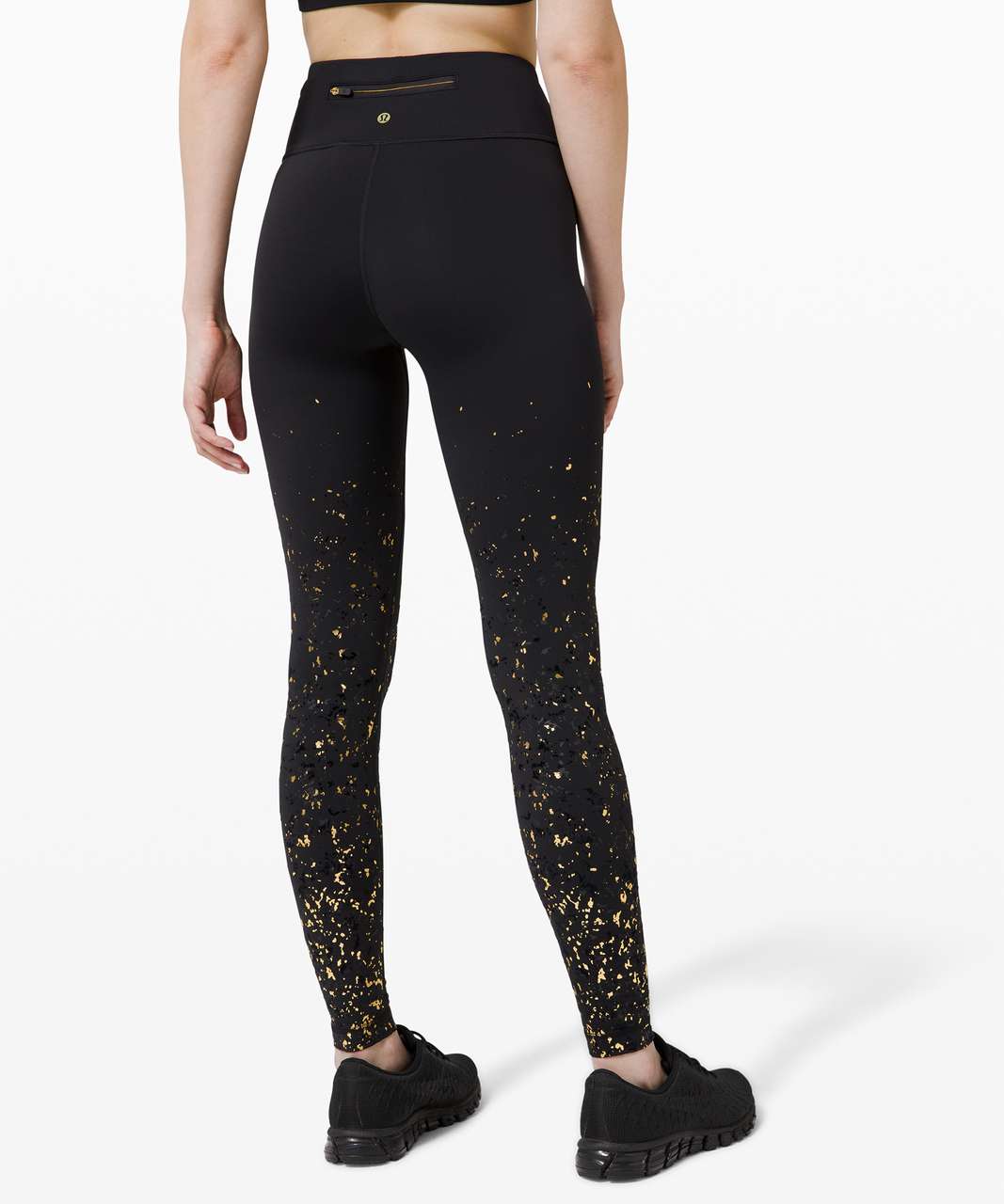 Womens lululemon leggings size 2 Gold and Black Metal or Beaded pattern