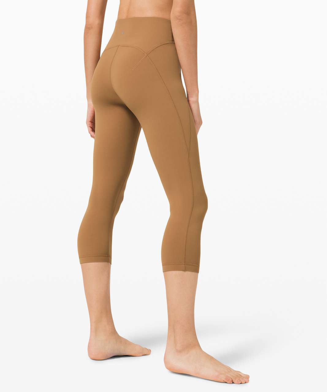 https://storage.googleapis.com/lulu-fanatics/product/56626/1280/lululemon-get-centred-high-rise-crop-21-saddle-brown-044662-317665.jpg