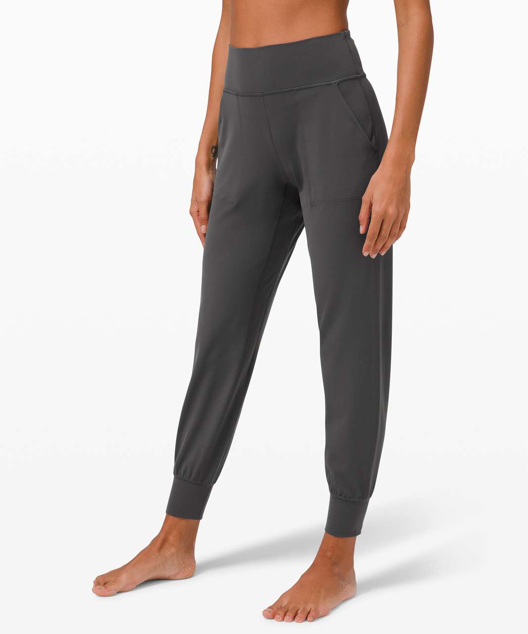 Photos of the align track stripe joggers in graphite grey/diamond dye in  size 10! I am usually a TTS 8 in leggings but sized up because the 8 was  too tight on