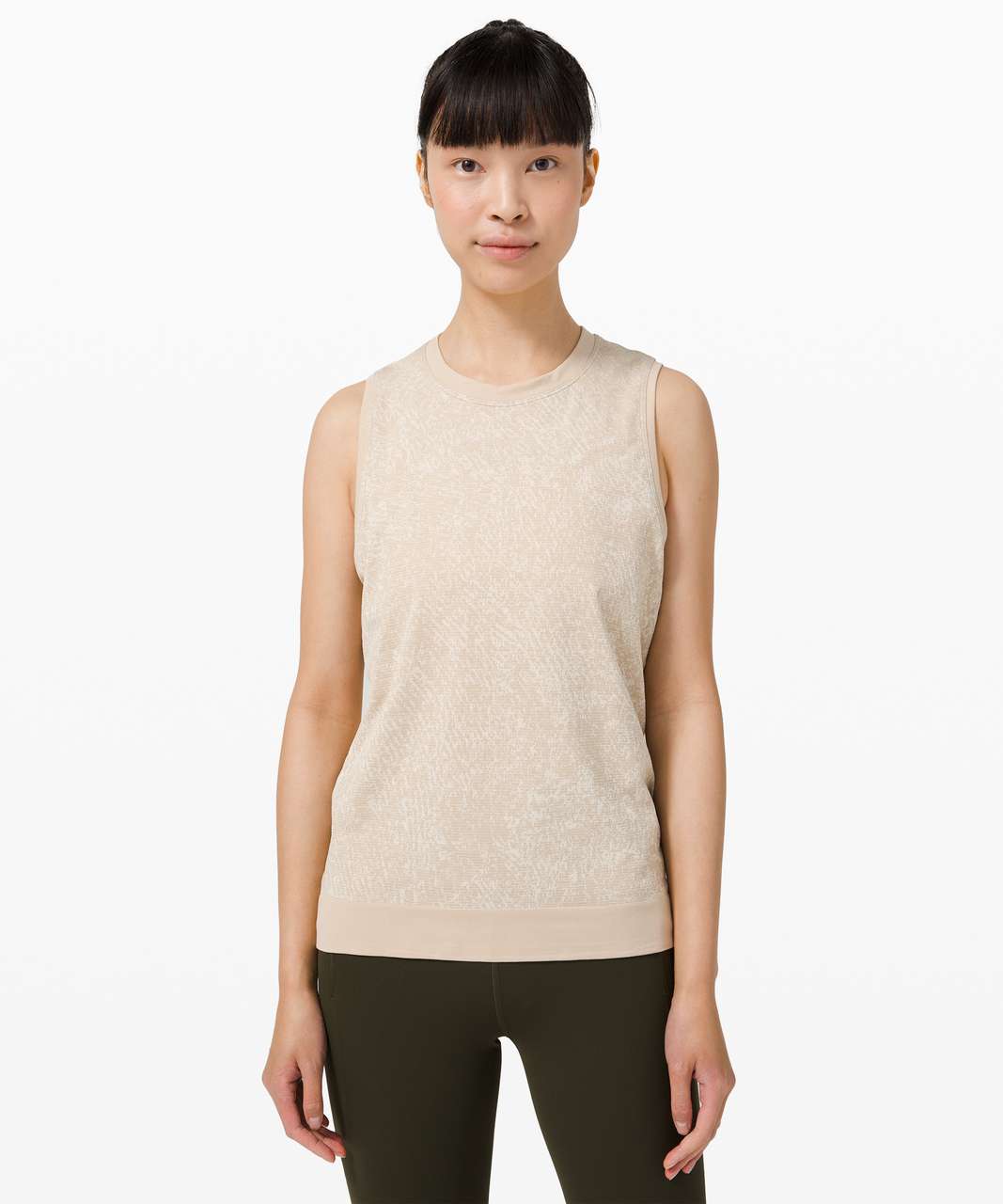 https://storage.googleapis.com/lulu-fanatics/product/62879/1280/lululemon-swiftly-breathe-muscle-tank-top-floral-fauna-cafe-au-lait-white-opal-047846-346704.jpg