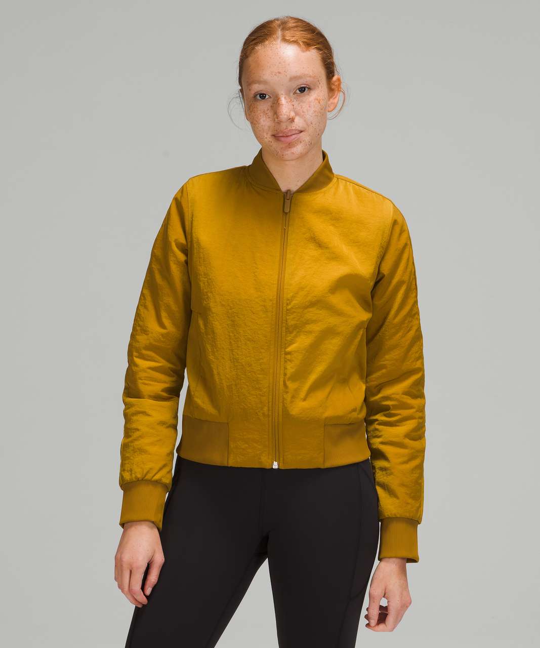 https://storage.googleapis.com/lulu-fanatics/product/63802/1280/lululemon-non-stop-bomber-reversible-gold-spice-048054-351096.jpg