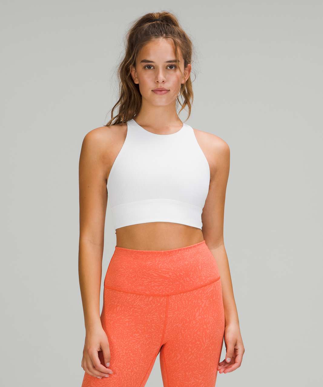 https://storage.googleapis.com/lulu-fanatics/product/64461/1280/lululemon-energy-bra-high-neck-long-line-rib-medium-support-b-d-cup-white-0002-353849.jpg