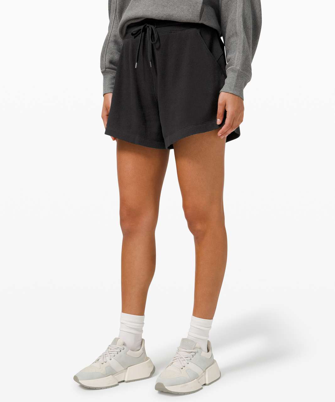 https://storage.googleapis.com/lulu-fanatics/product/64478/1280/lululemon-mellow-in-high-rise-short-5-waffle-black-0001-353919.jpg